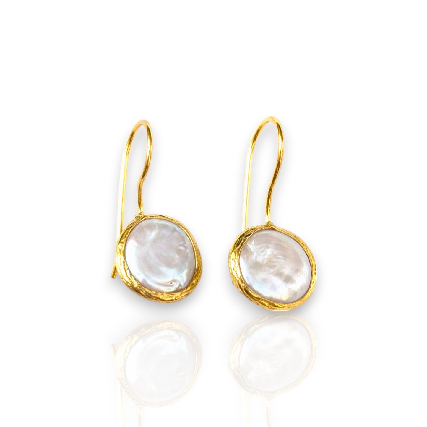 Coin pearl drop earrings with textured gold bezels and iridescent pearls.
