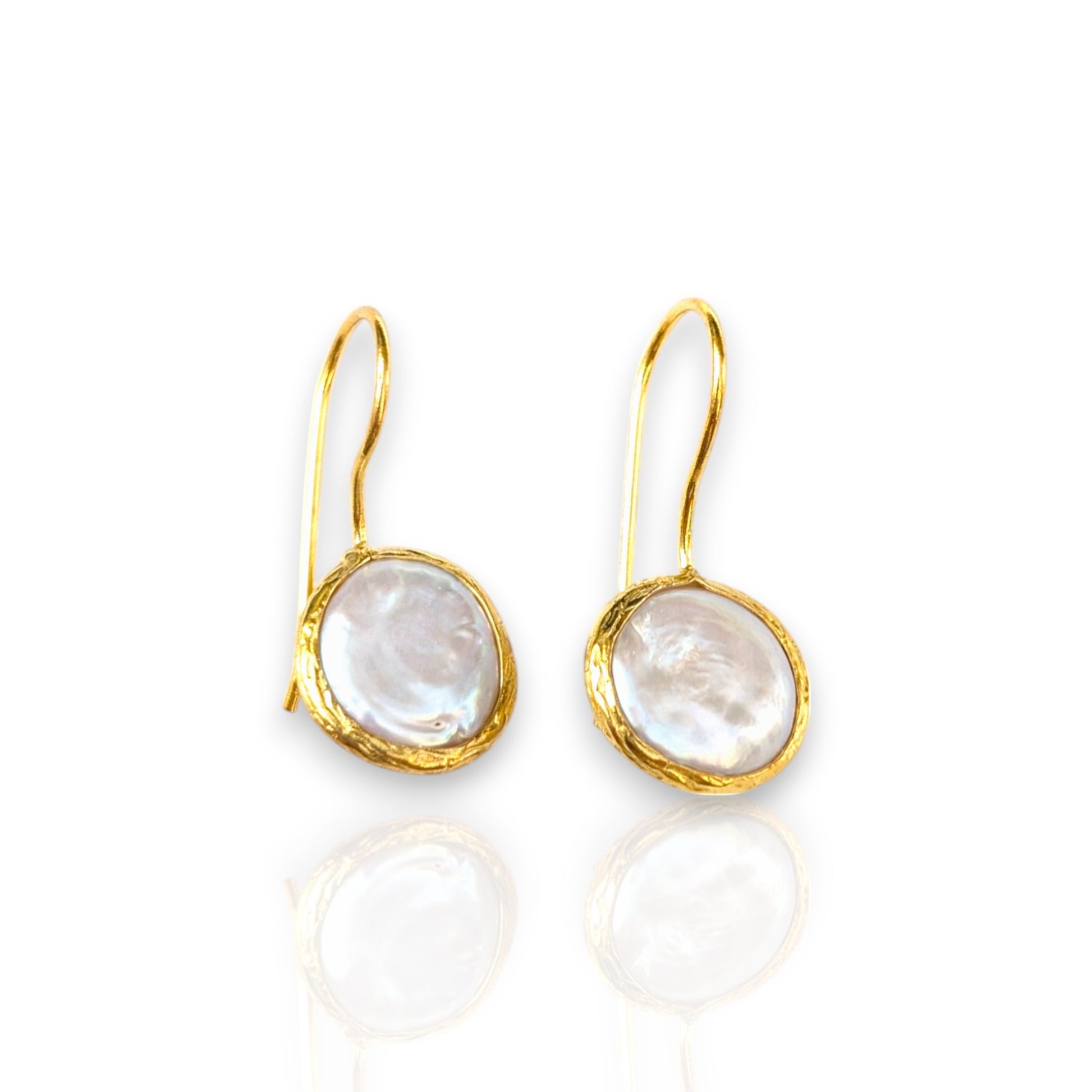 Coin pearl drop earrings with textured gold bezels and iridescent pearls.