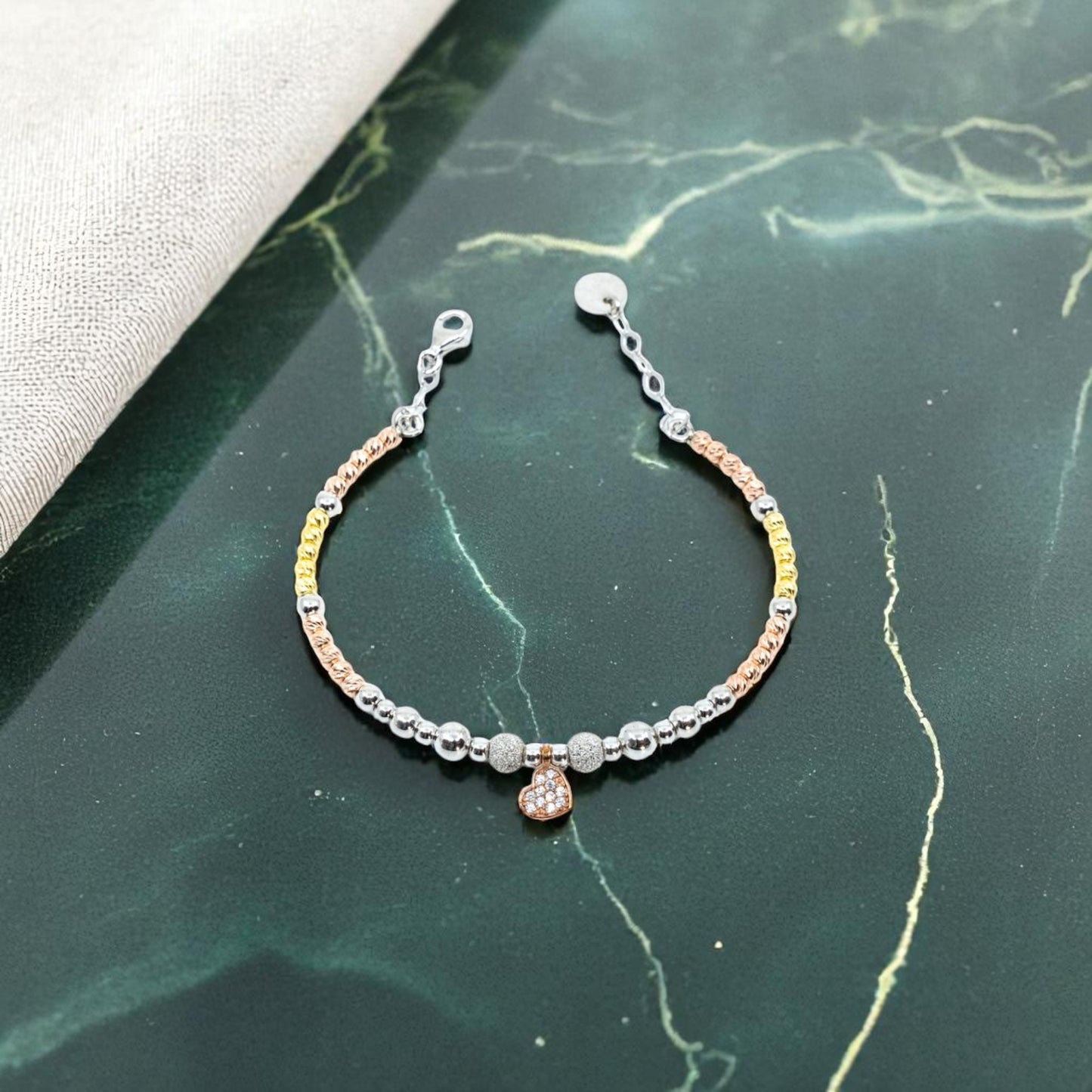 Heart bracelet with gold and silver beads