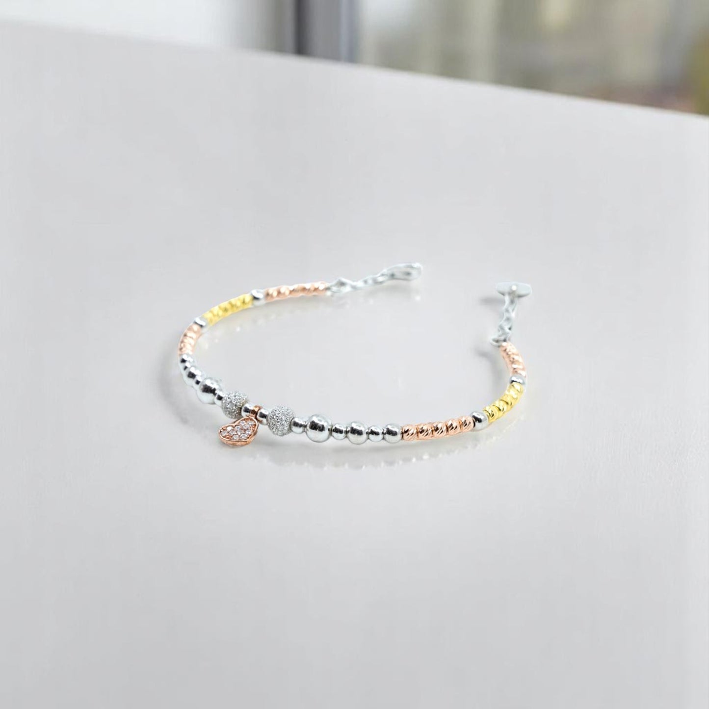 Heart bracelet with gold and silver beads
