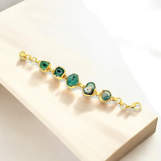 Polished green agate gemstone with gold trim on adjustable with adjustable chain