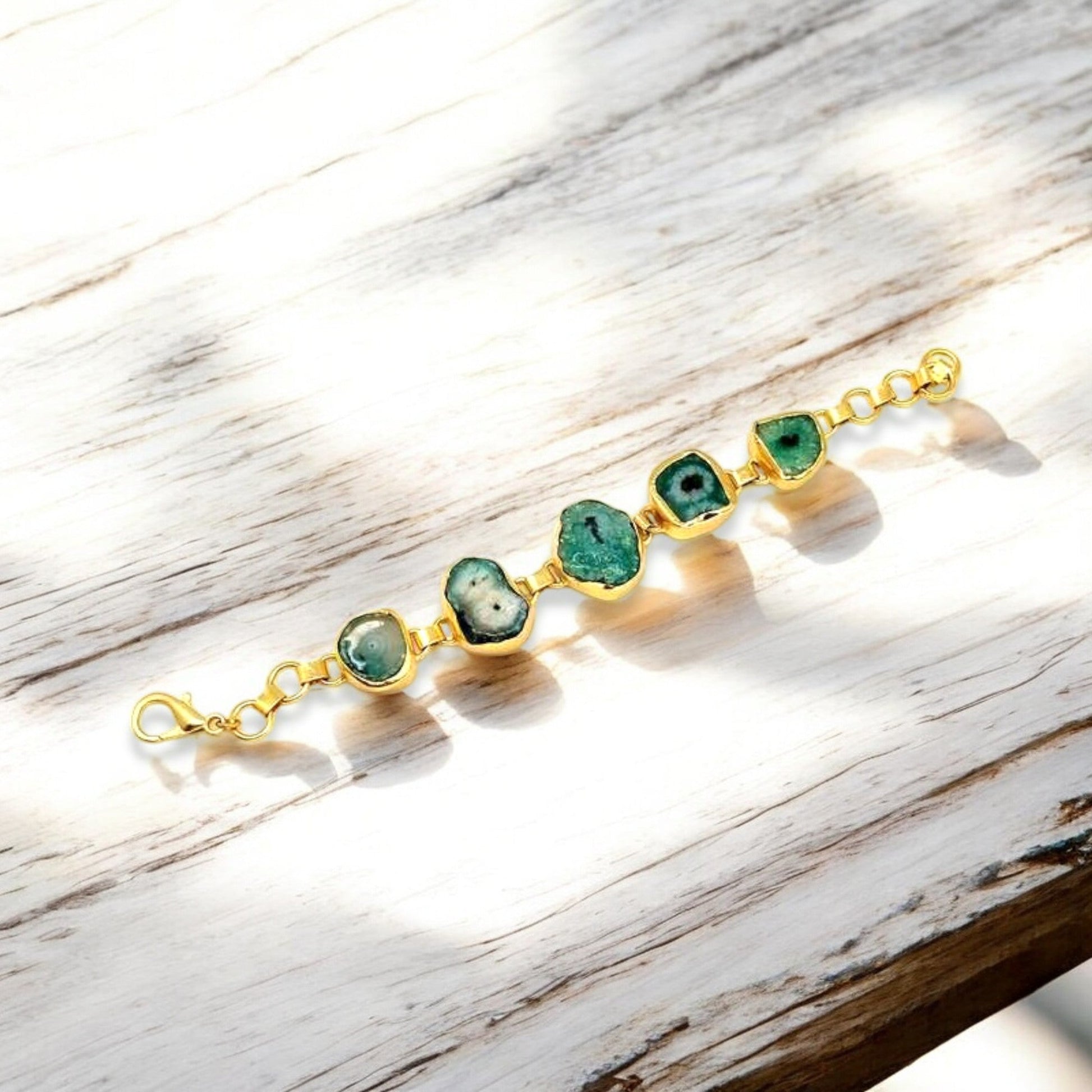 Polished green agate gemstone with gold trim on adjustable with adjustable chain