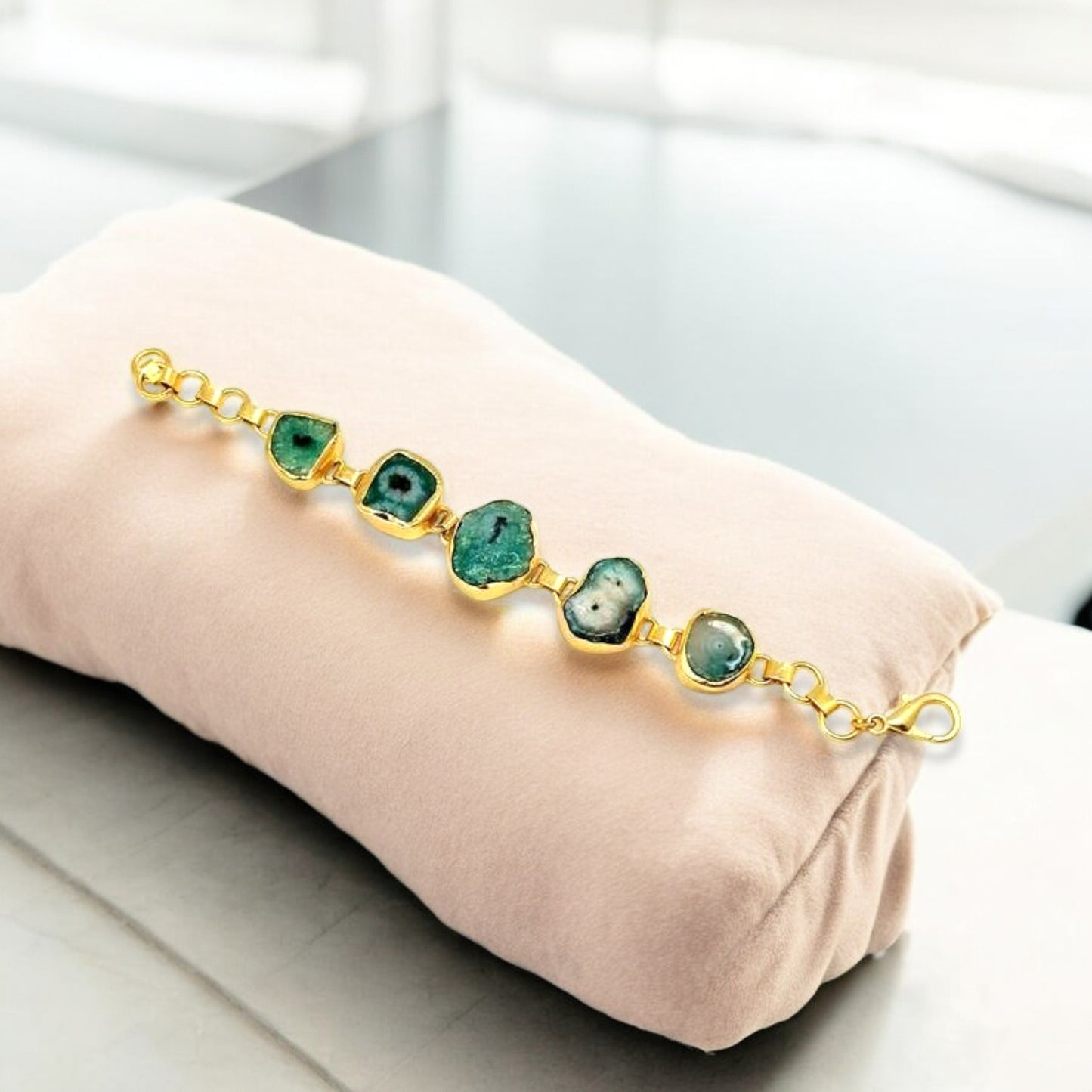 Polished green agate gemstone with gold trim on adjustable with adjustable chain