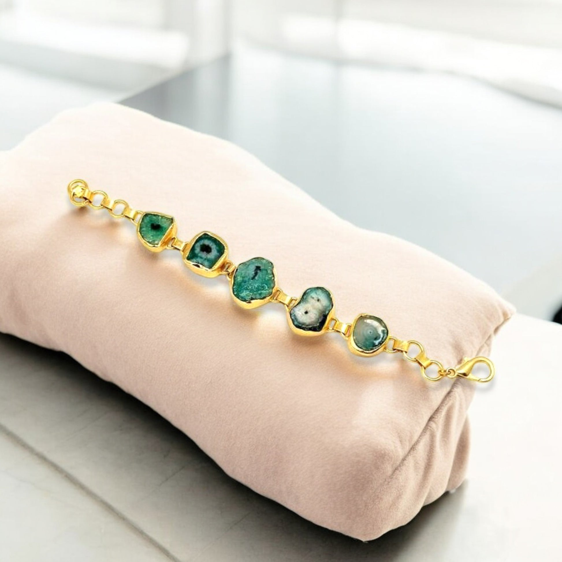 Polished green agate gemstone with gold trim on adjustable with adjustable chain