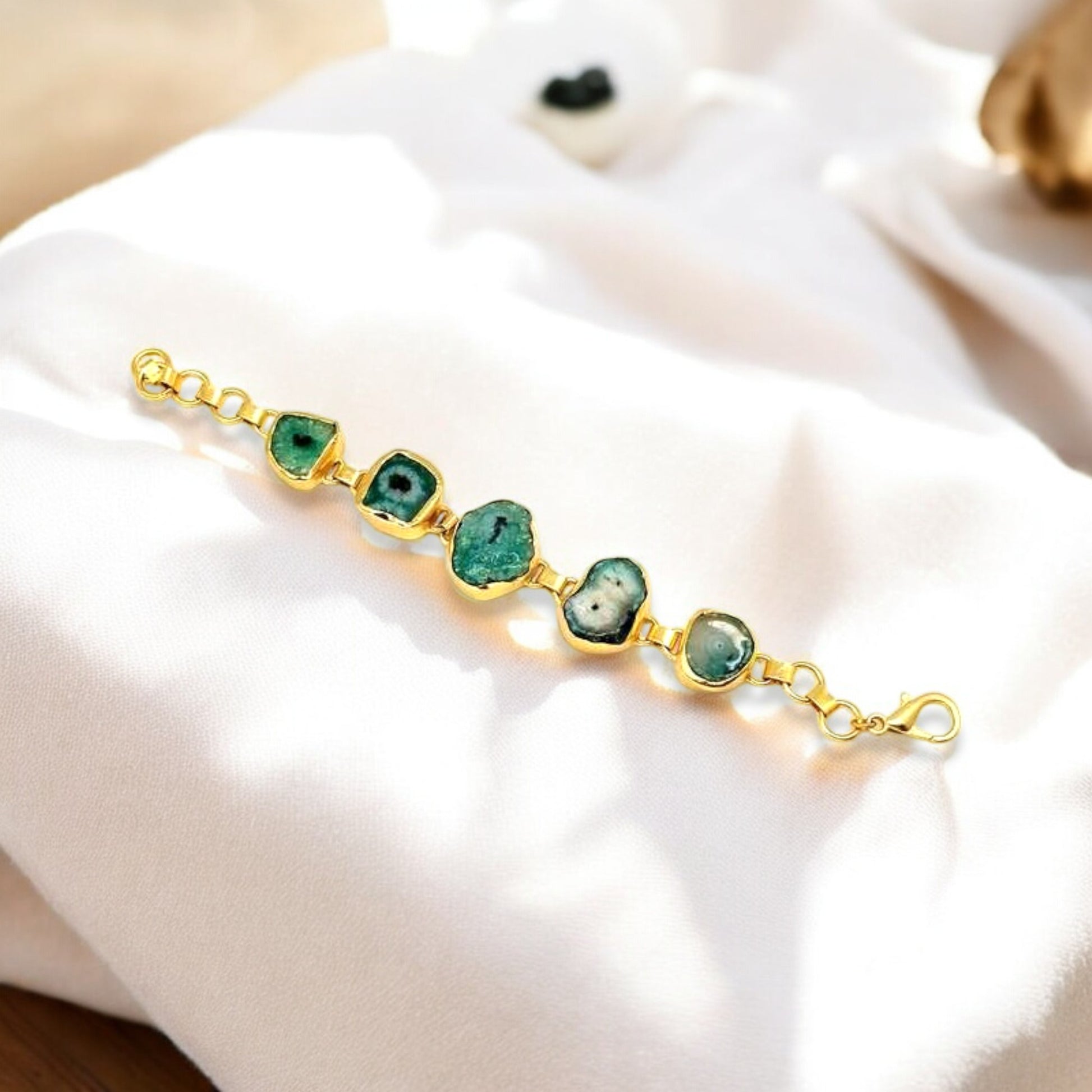 Polished green agate gemstone with gold trim on adjustable with adjustable chain