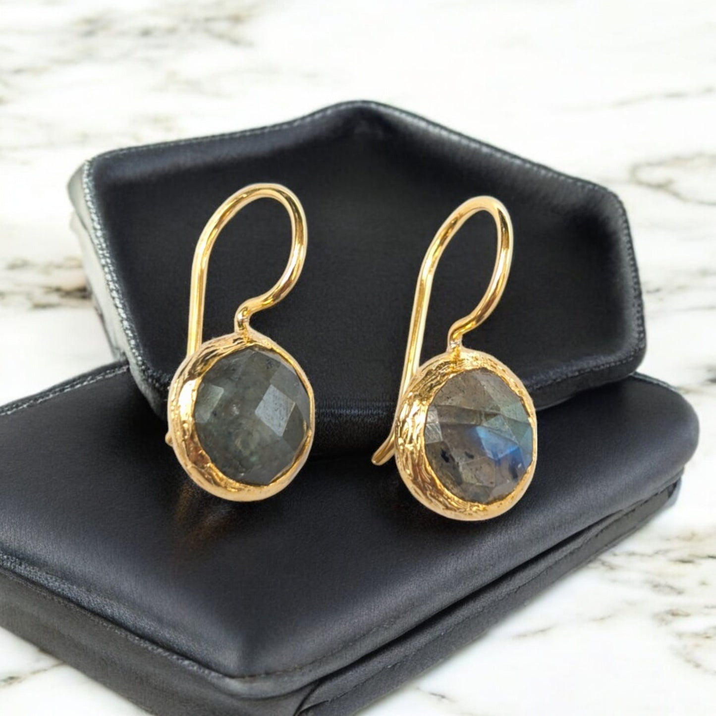 Labradorite drop earrings with gold-toned bezels and iridescent stones."