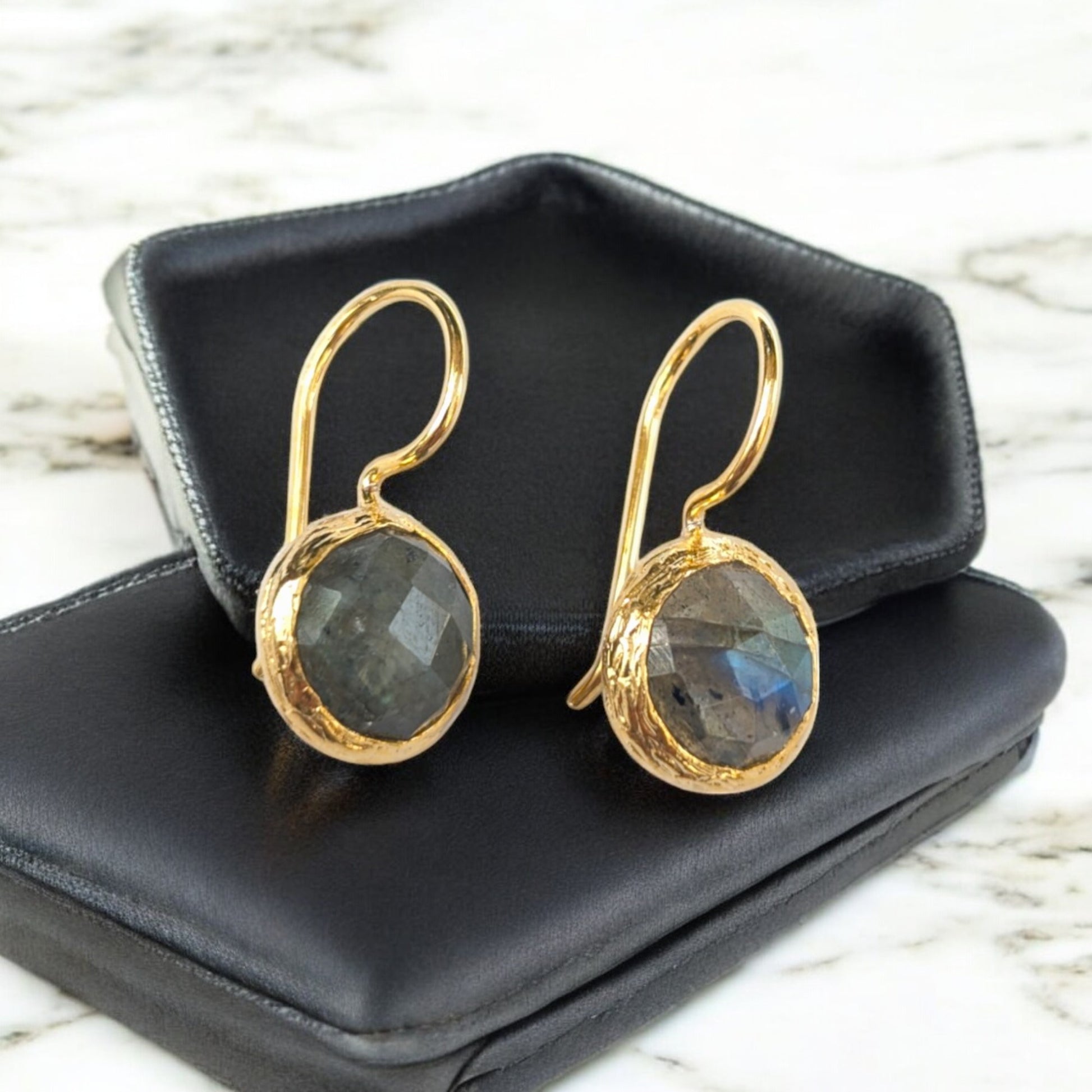 Labradorite drop earrings with gold-toned bezels and iridescent stones."