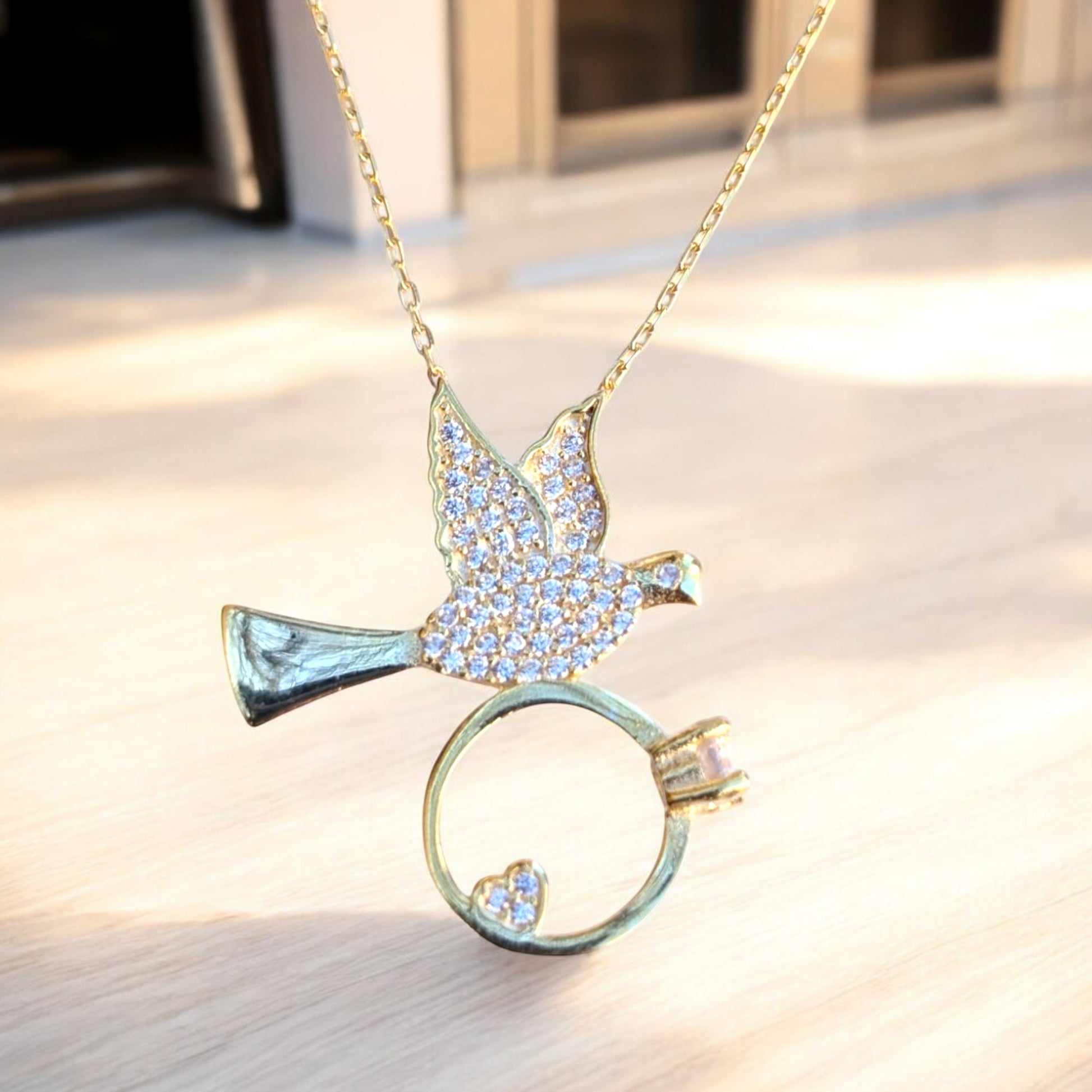 dove necklace with heart ring and cubic zirconia stones