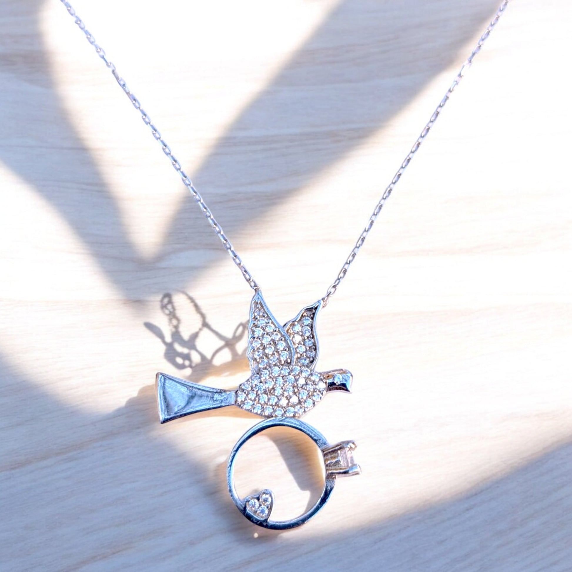 dove necklace with heart ring and cubic zirconia stones