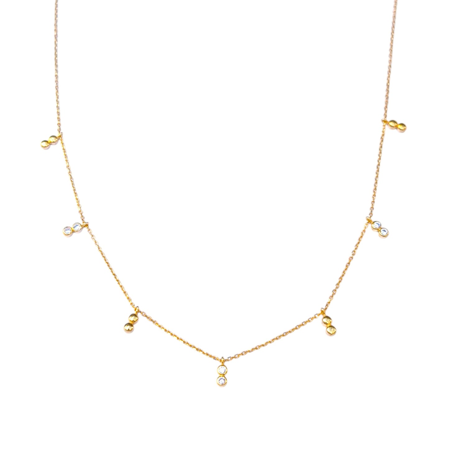 Delicate gold necklace with bezel-set CZ accents