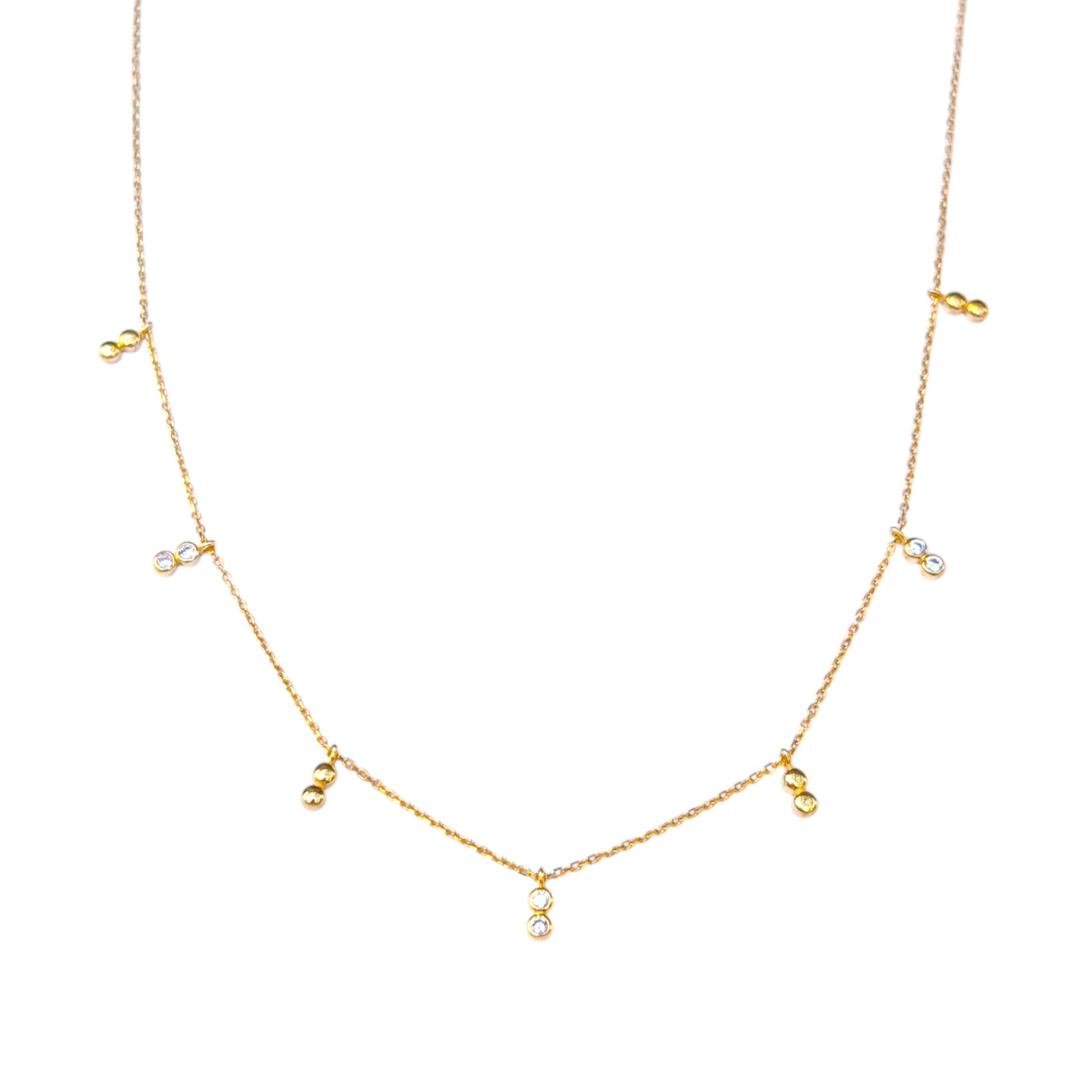 Delicate gold necklace with bezel-set CZ accents