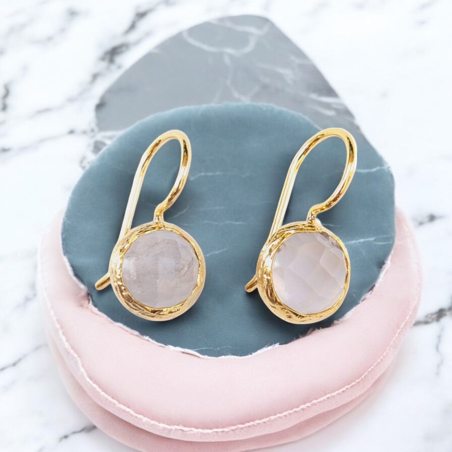 Moonstone drop earrings with textured gold bezels and faceted moonstones