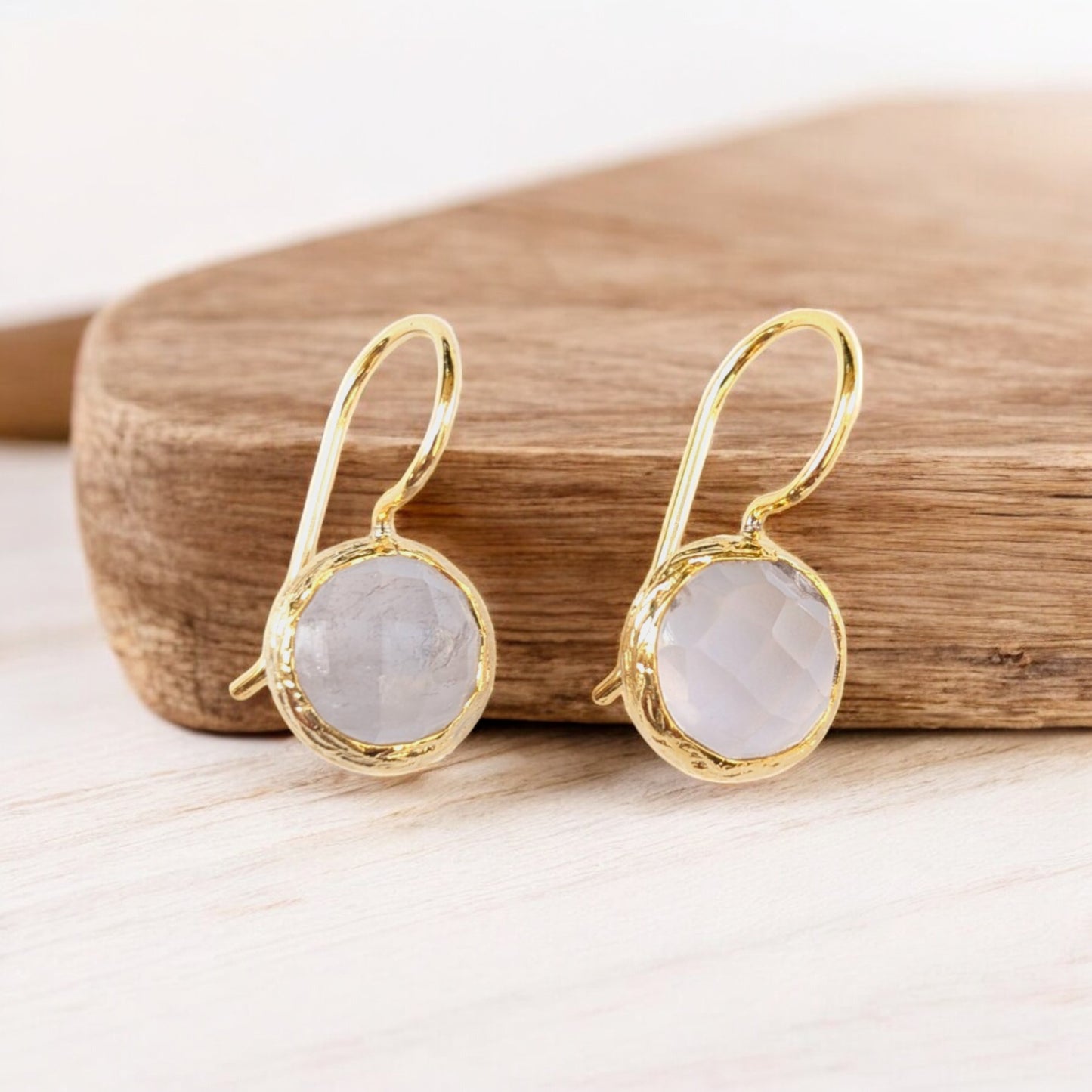 Moonstone drop earrings with textured gold bezels and faceted moonstones