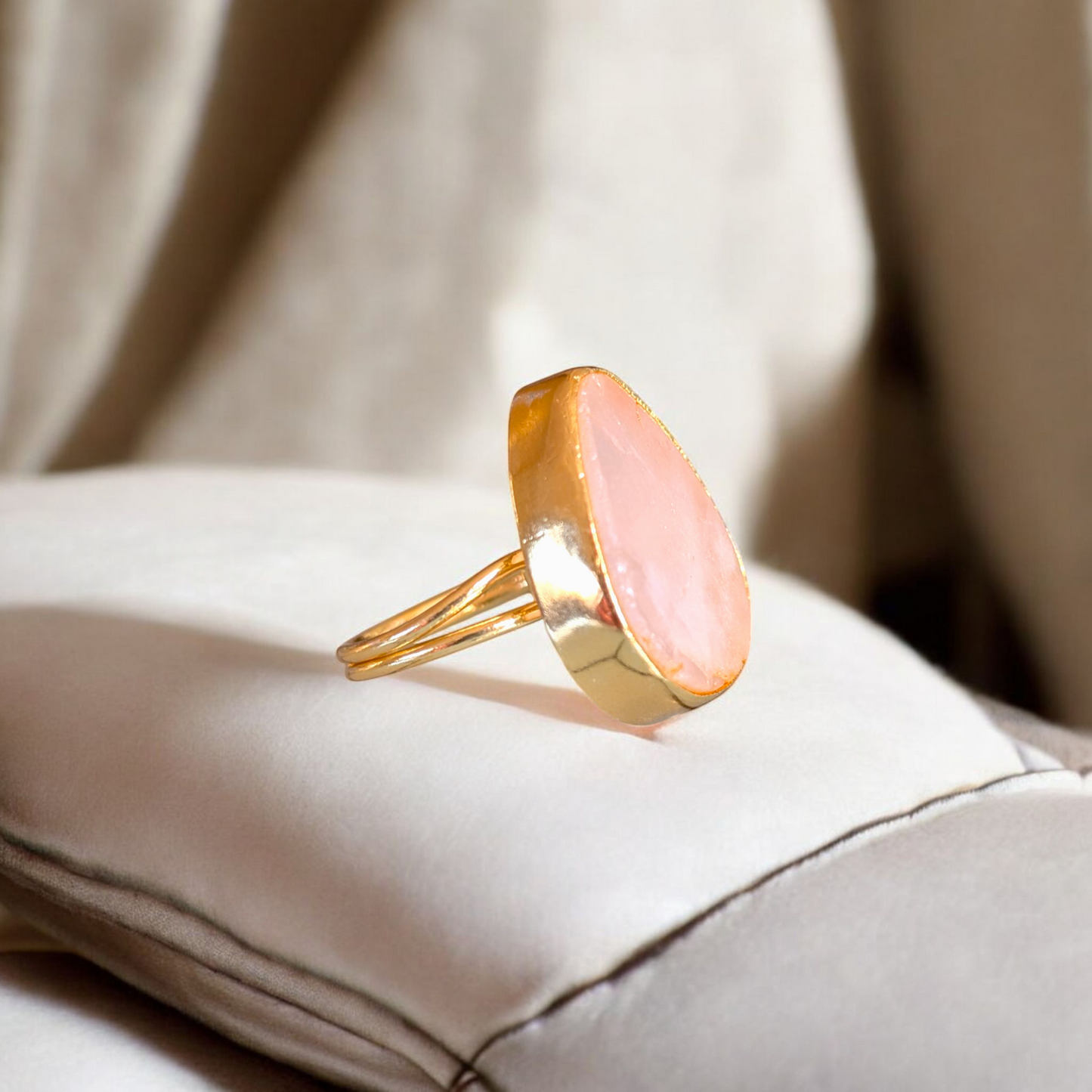 Teardrop rose quartz ring with gold bezel and double band