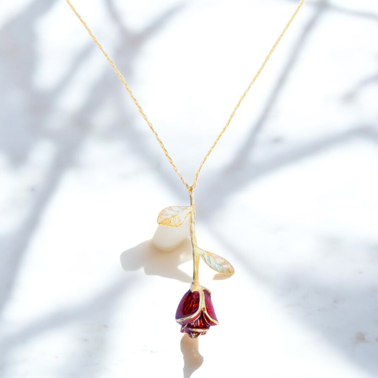 Delicate rose pendant necklace with red enamel bloom and silver chain
