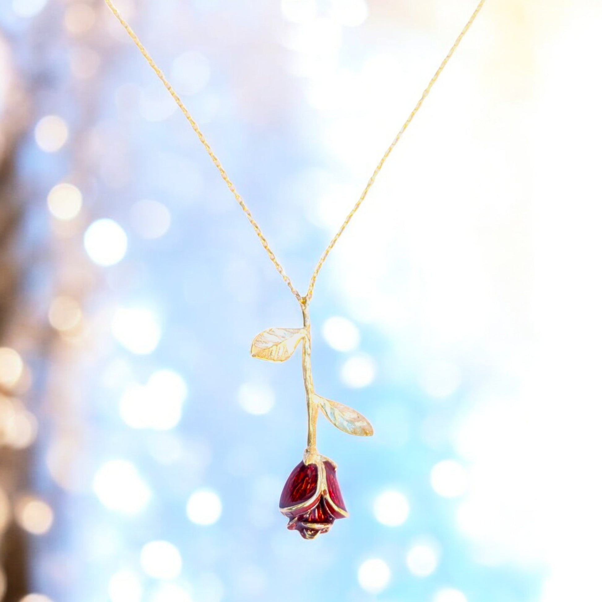 Delicate rose pendant necklace with red enamel bloom and silver chain