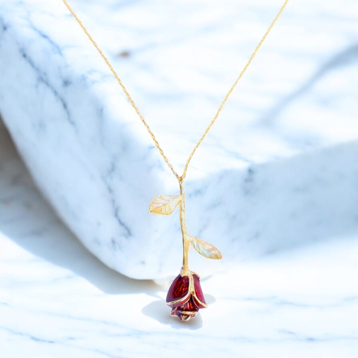 Delicate rose pendant necklace with red enamel bloom and silver chain