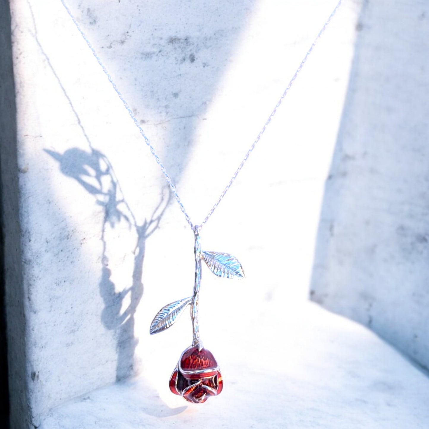 Delicate rose pendant necklace with red enamel bloom and silver chain