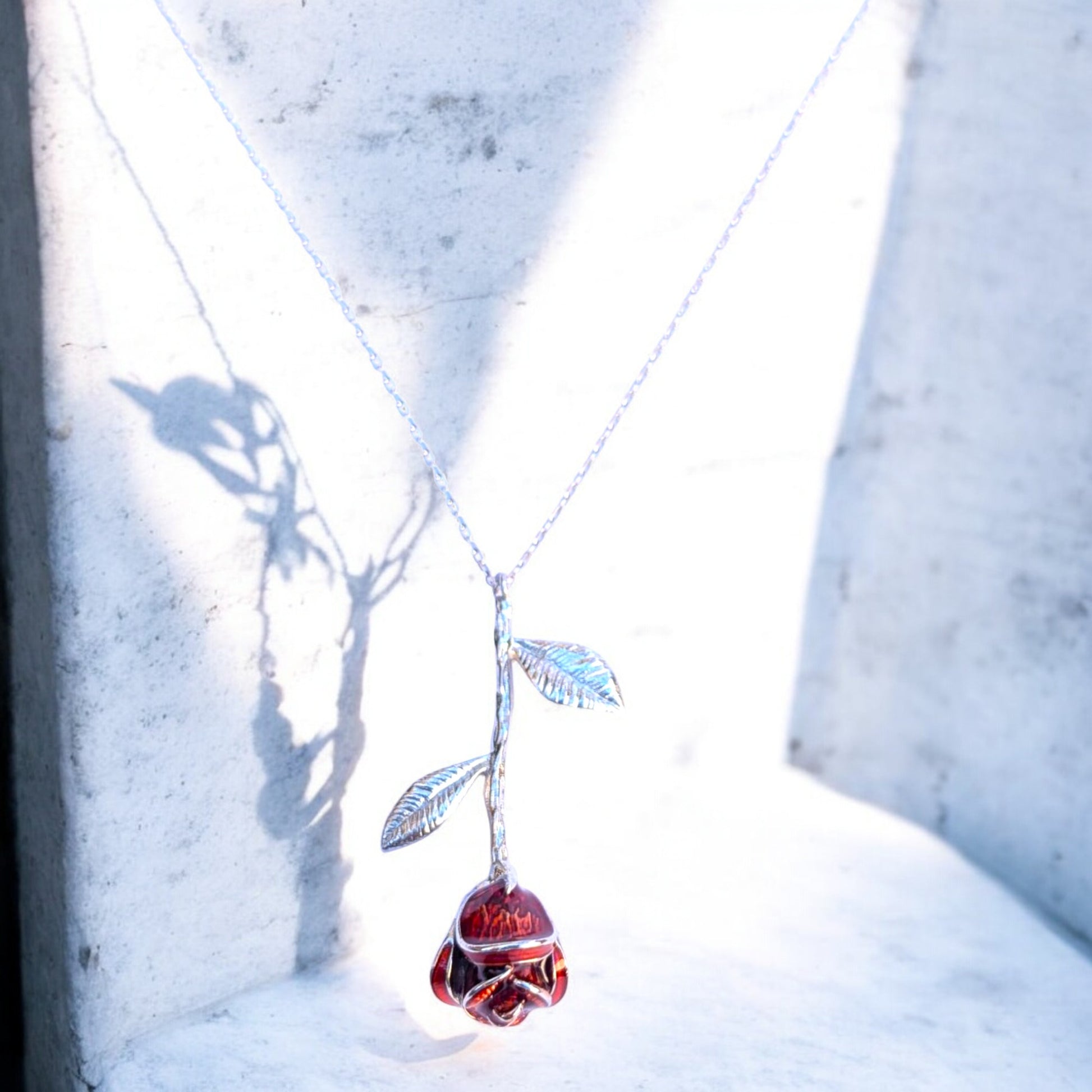Delicate rose pendant necklace with red enamel bloom and silver chain