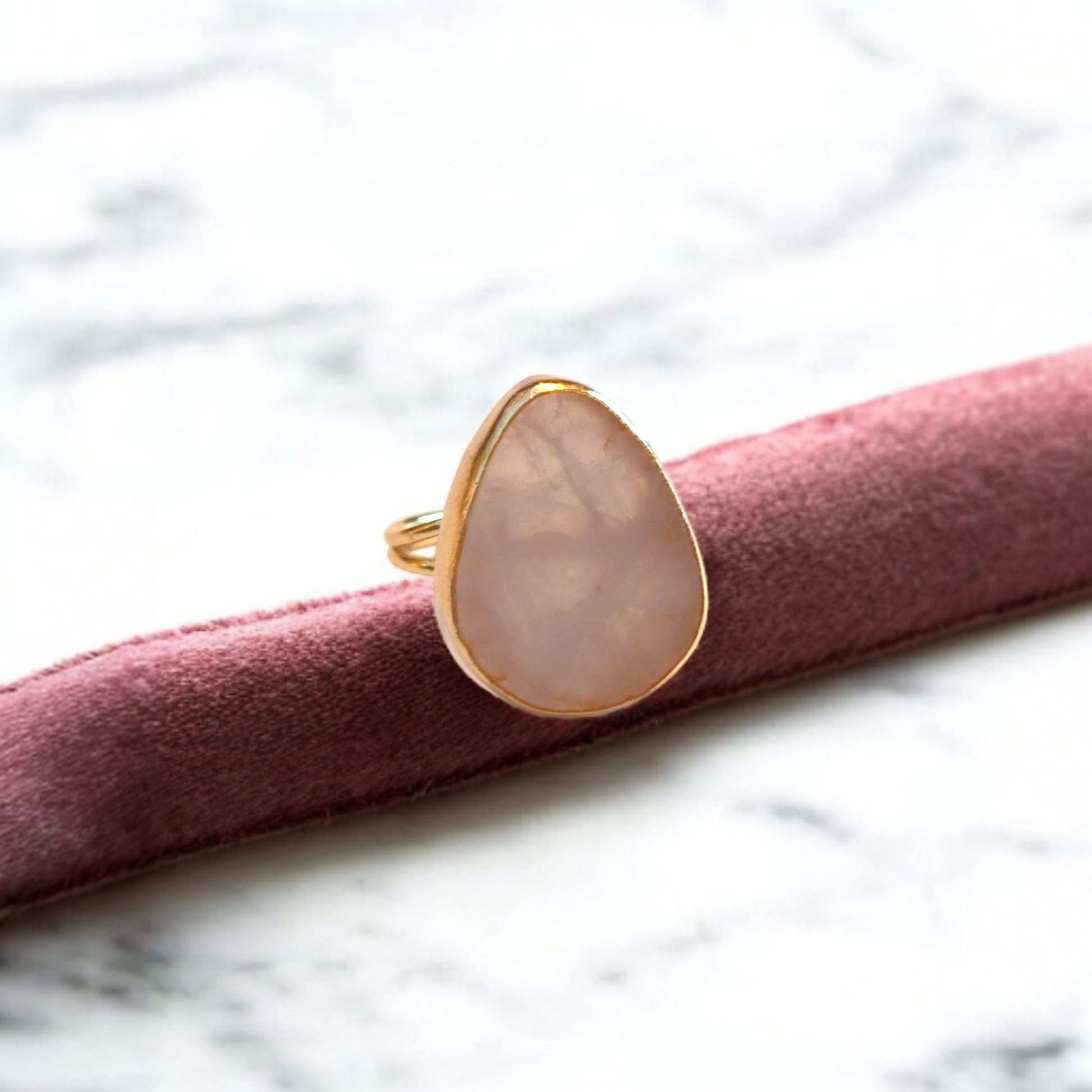 Teardrop rose quartz ring with gold bezel and double band