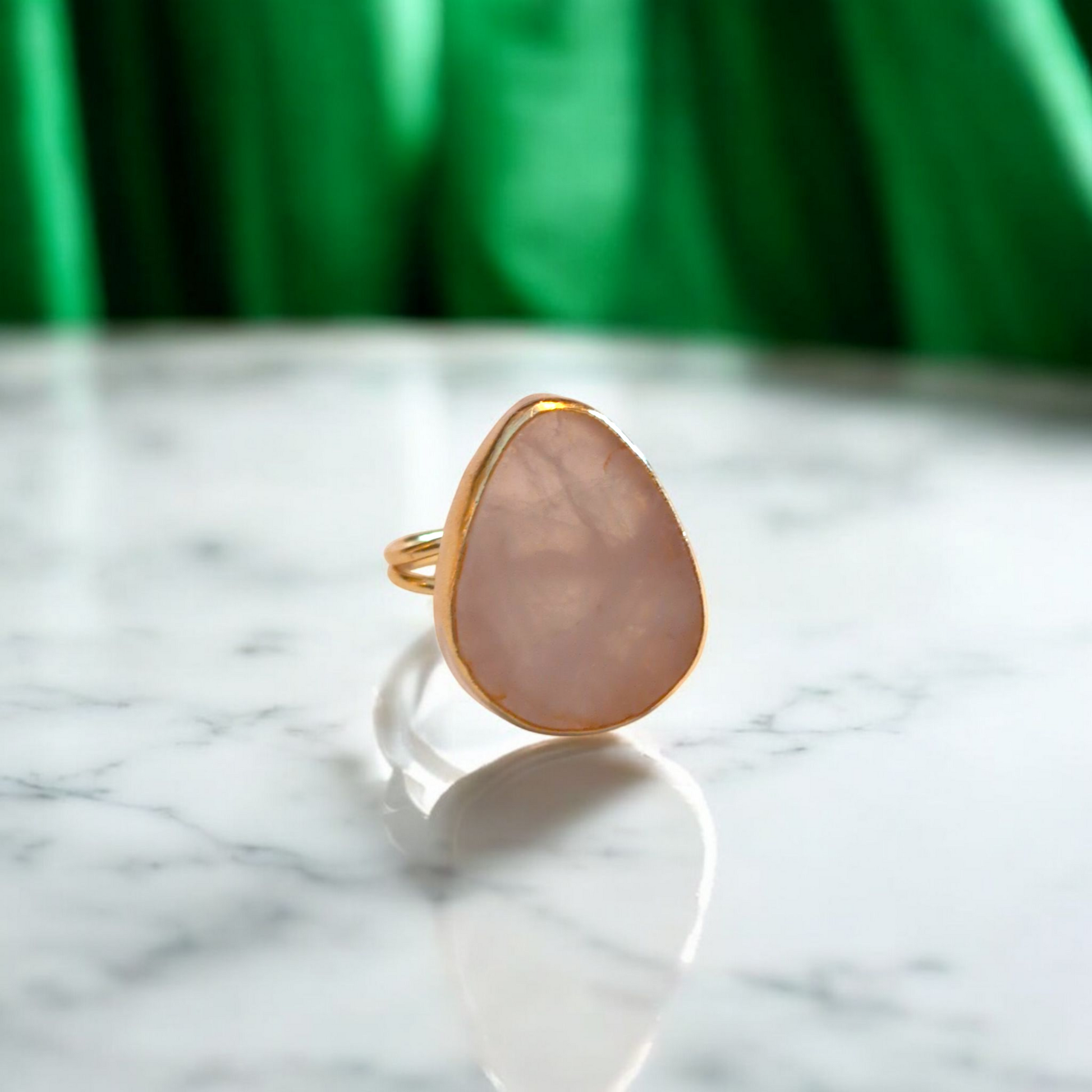 Teardrop rose quartz ring with gold bezel and double band