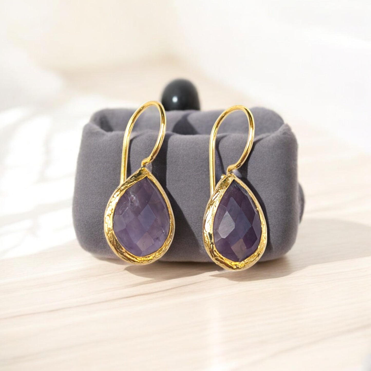 Teardrop amethyst bezel earrings with gold-plated trim