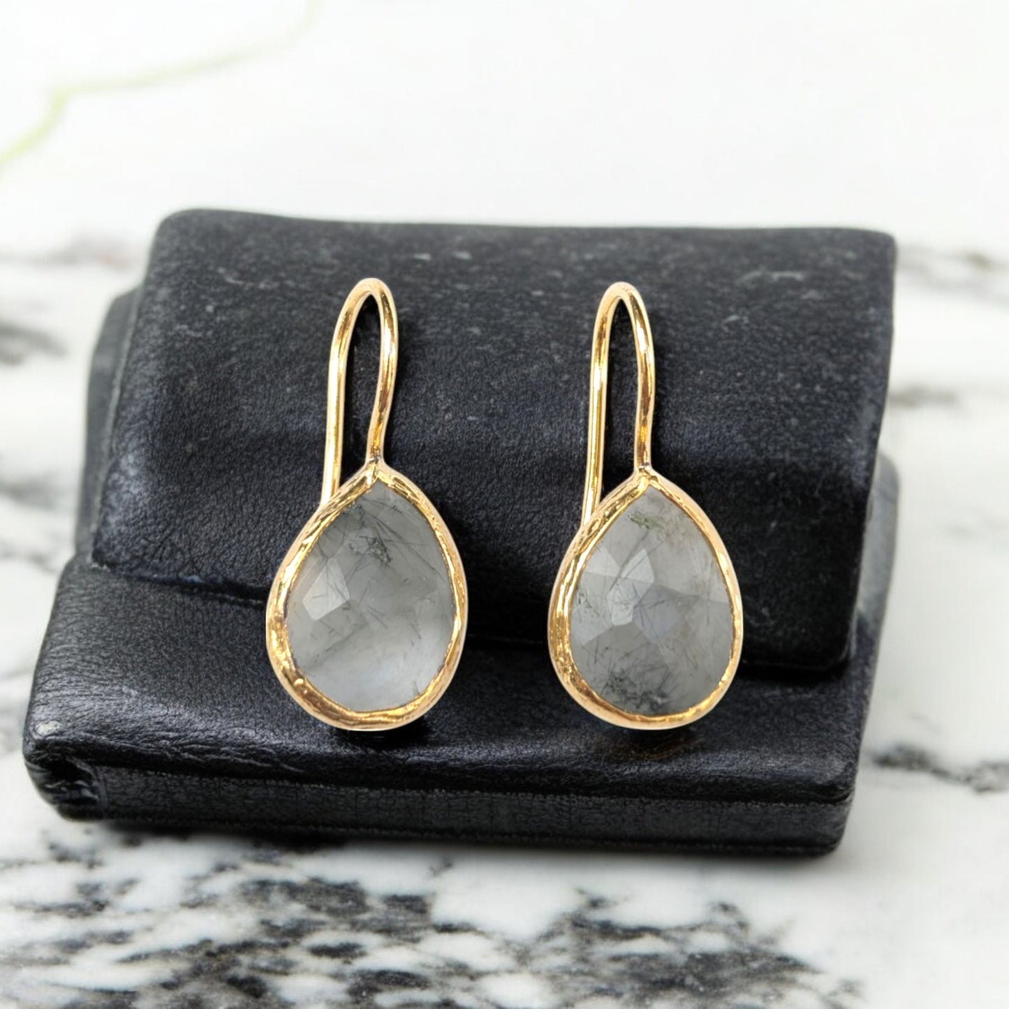 Handmade teardrop Rutilated quartz earrings with gold bezel trim.