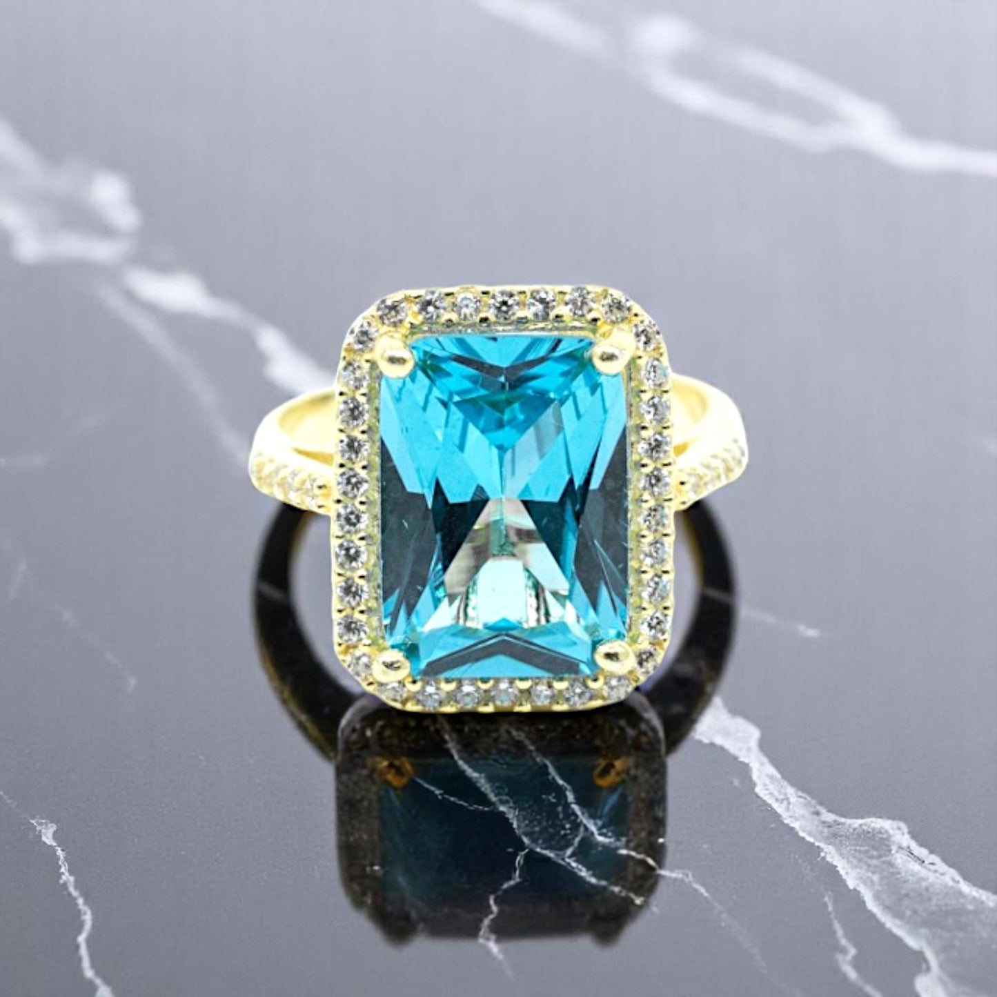 Gold Ring With Light Blue Stone
