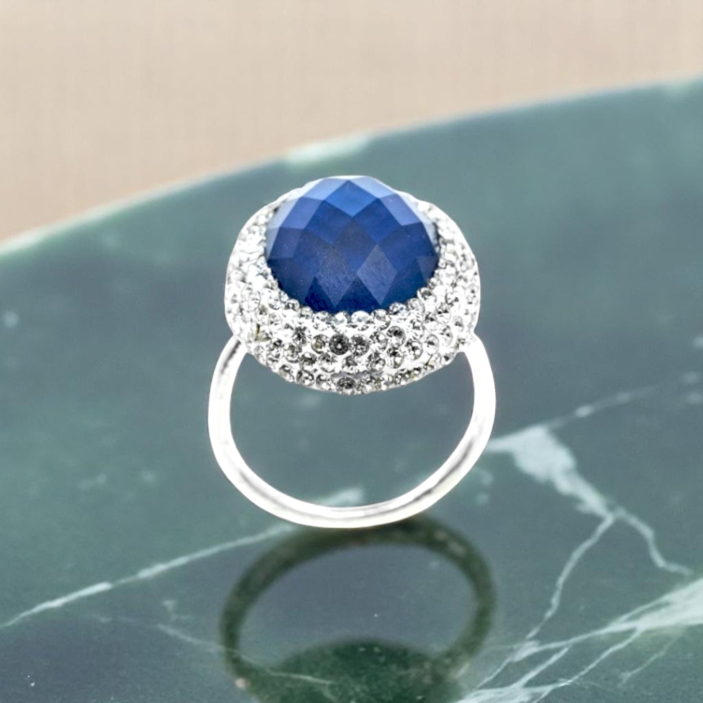 Emerald cut blue stone ring