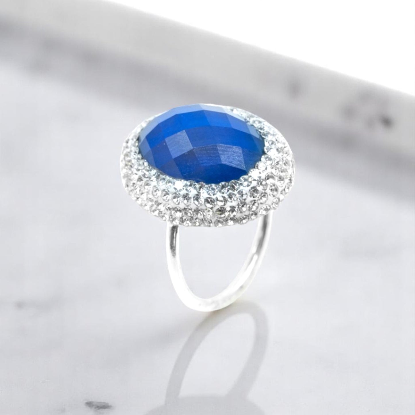 Emerald cut blue stone ring