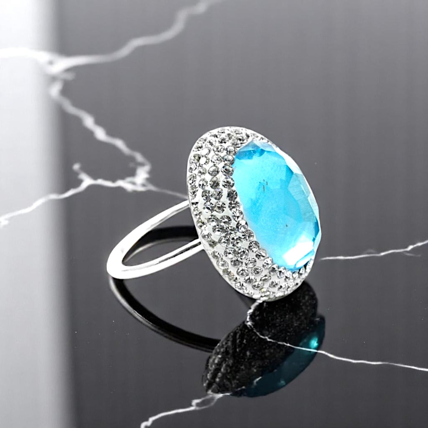 Round Baby Blue Stone Ring with Hematite Trim